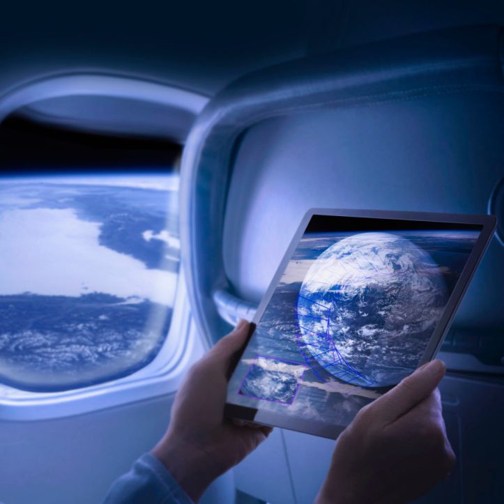 Woman views screen data on passenger space flight